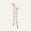 Longues boucles d'oreilles en perles sur fil rouge