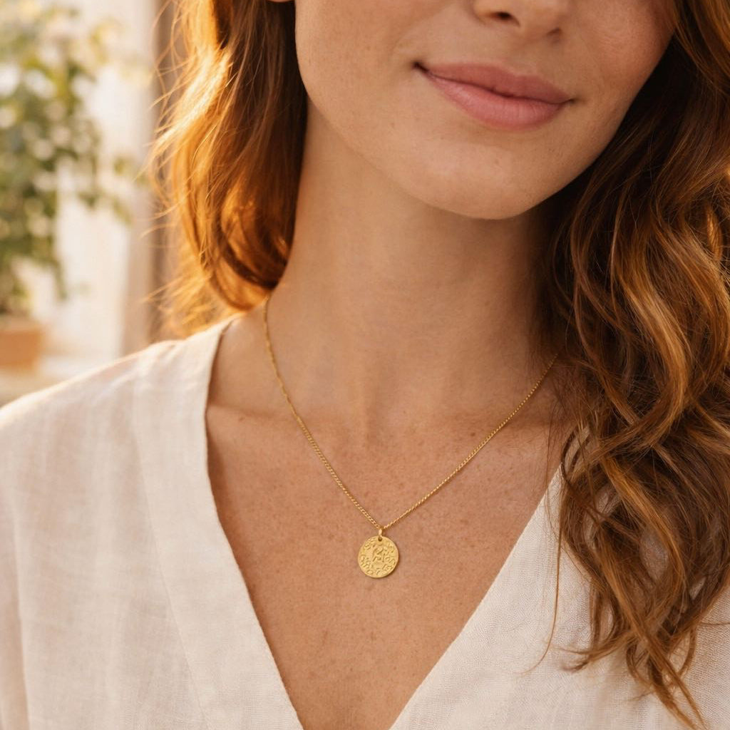 médaille porte bonheur à porter toujours autour du cou